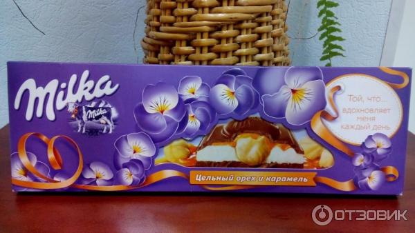 Шоколад молочный Milka с молочной и карамельной начинкой и цельным фундуком фото