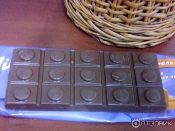 Шоколад молочный Milka с молочной и карамельной начинкой и цельным фундуком фото