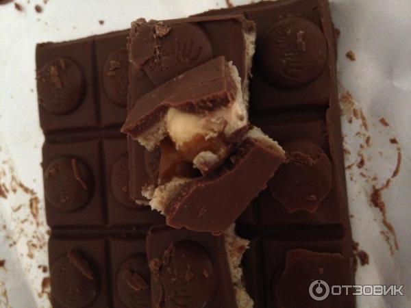 Шоколад Milka Toffee Wholenut с целыми лесными орехами, молочной и карамельной начинкой фото