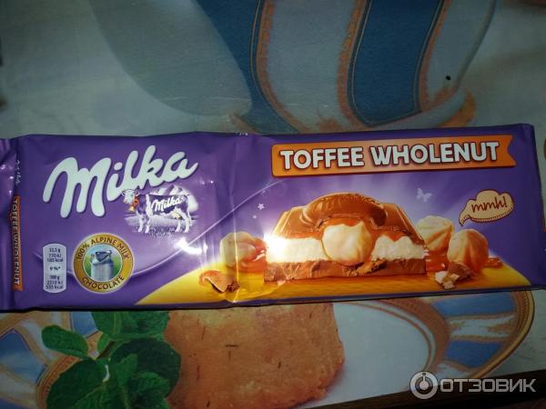 Шоколад Milka Toffee Wholenut с целыми лесными орехами, молочной и карамельной начинкой фото