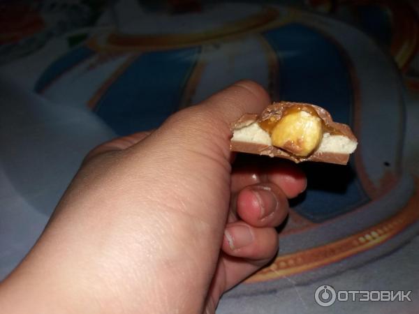 Шоколад Milka Toffee Wholenut с целыми лесными орехами, молочной и карамельной начинкой фото