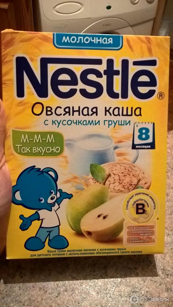 Детская молочная каша Nestle овсяная с кусочками груши фото