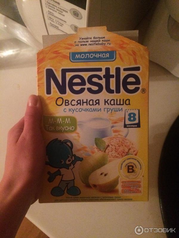 Детская молочная каша Nestle овсяная с кусочками груши фото