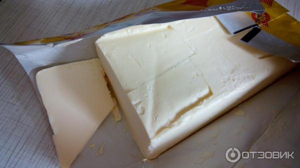 Масло сливочное Курскмаслопродукт Крестьянское. Элитное фото