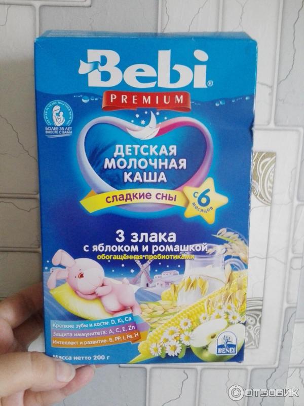 Детская молочная каша Bebi Premium 3 злака с яблоком и ромашкой фото